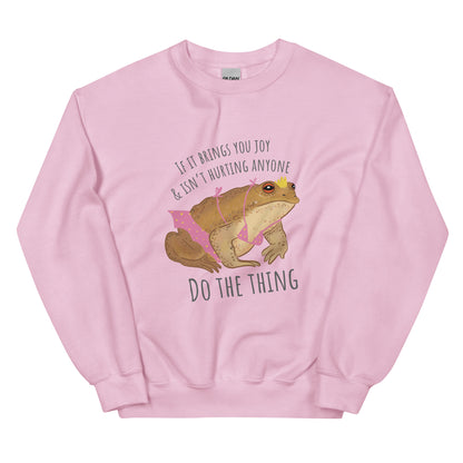 Fairy toad t-shirt with whimsical fairycore illustration. Pink sweatshirt with illustration of toad in pink bikini with crown and the words if you aren't hurting anyone and it brings you joy then do the thing
